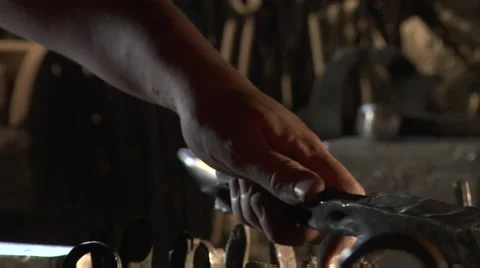 Blacksmith heats a torch in fire, he is preparing for forging. Stock Footage 49397528