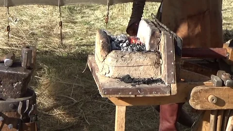 The blacksmith heats the workpiece Stock Footage 79922116
