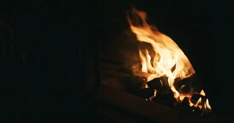 Blacksmith heets iron plate in an open fire furnace 01 (color graded) Stock Footage 126967142