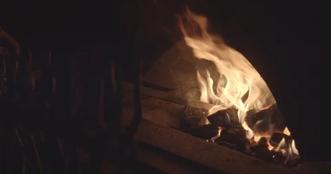 Blacksmith heets iron plate in an open fire furnace 01 (non graded) Stock Footage 126967150