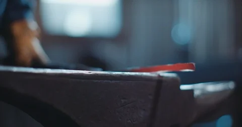 Blacksmith in his forge working on iron piece Stock Footage 105296068
