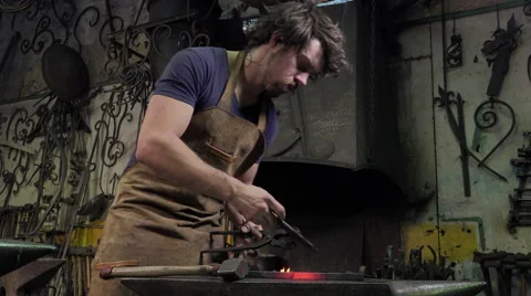 Blacksmith in his workshop Video stock 58149475