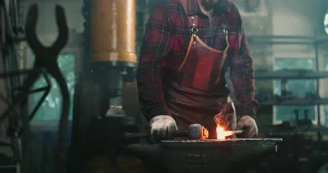 The blacksmith hits the metal close-up Stock-Footage 165212281