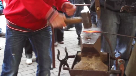 Blacksmith Holds Guy Strikes Stock Footage 8659542