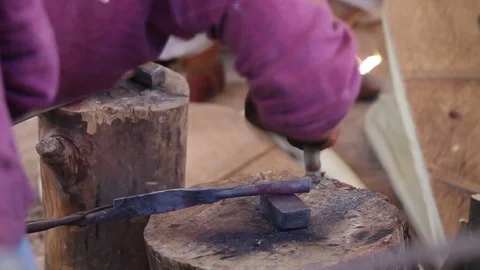 Blacksmith with hot steal and hammer, Stock Footage 76876515