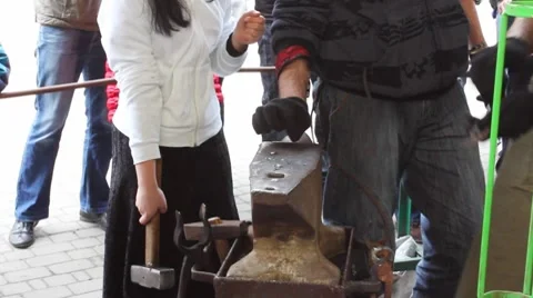 Blacksmith Instructs Girl Video stock 8659536
