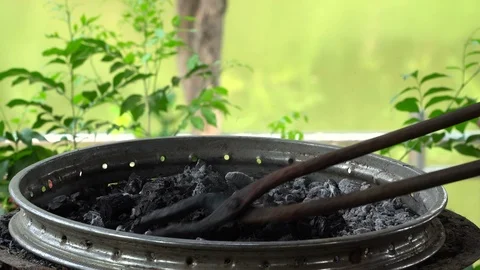 The blacksmith kicks a horseshoe close up Stock Footage 100433823