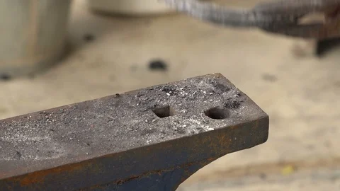 The blacksmith kicks a horseshoe close up Stock Footage 107175546