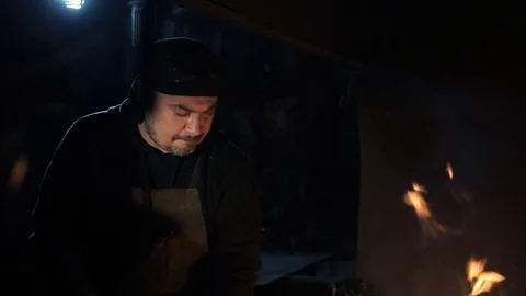 Blacksmith kindle a fire in the hearth 库存影片 69859017