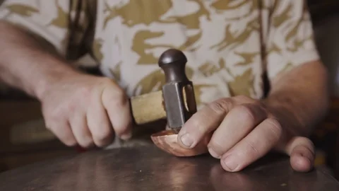 The blacksmith knocks with a hammer, giving a shape to the workpiece Video stock 94937533