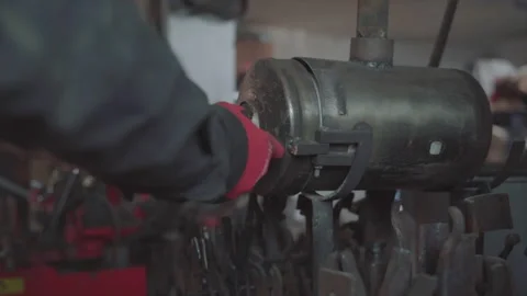 Blacksmith lights a fire in the forge. Damascus steel knife. Stock Footage 194486017