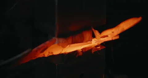 Blacksmith makes a grooved surface for decorative red-hot forged metal product Stock Footage 151890668