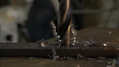 Blacksmith makes an hole on iron with drill Stock Footage 119420568