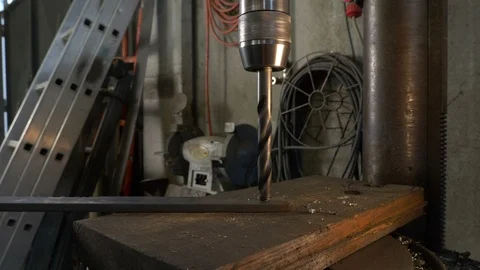 Blacksmith makes an hole on iron with drill 스톡 동영상 119420661