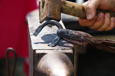 Blacksmith makes a horseshoe  close-up Stock Photos