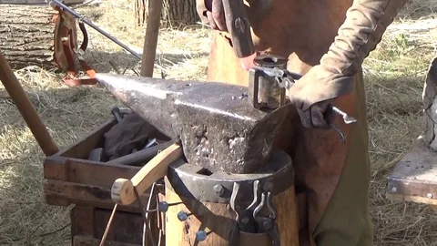 The blacksmith makes a horseshoe Stock Footage 80959586