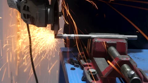Blacksmith man cuts iron with hand iron cutting machine Stock Footage 293060419