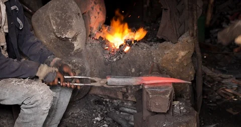 Blacksmith Man working with the bending metal Ethiopia Bahir Dar Stock Footage 119145915