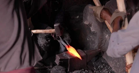 Blacksmith Man working with the bending metal Ethiopia Bahir Dar Stock Footage 119146262