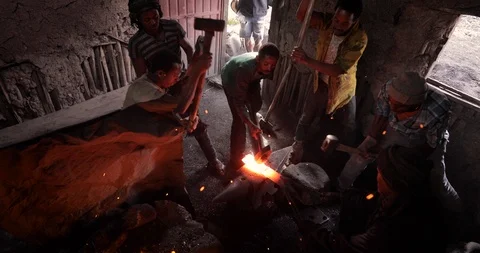 Blacksmith Man working with the bending metal Ethiopia Bahir Dar Stock Footage 119146352