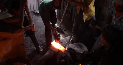 Blacksmith Man working with the bending metal Ethiopia Bahir Dar Stock Footage 119146622