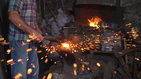 Blacksmith manually forging the molten fire. Stock Footage 146934361