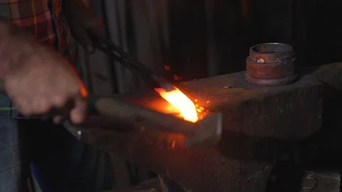 Blacksmith manually forging the molten fire. Stock Footage 147005250