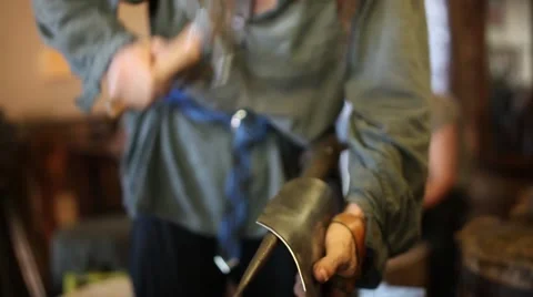 A blacksmith at a medieval fair Stock Footage 44631839