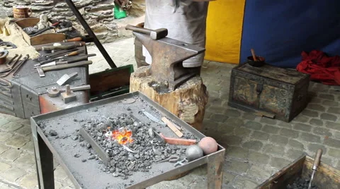 Blacksmith. Medieval tradition of making armor and swords at the forge. Stock Footage 40489884