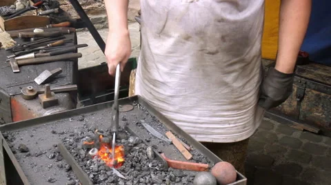 Blacksmith. Medieval tradition of making armor and swords at the forge. Video stock 40490148