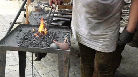 Blacksmith. Medieval tradition of making armor and swords at the forge. Stock Footage 41350025