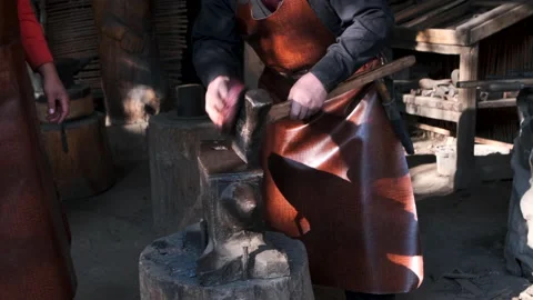 The blacksmith performs the ritual of blessing the tools Stock Footage 170180095