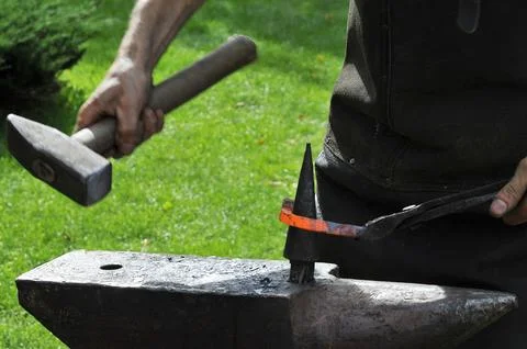 The blacksmith, a person who creates objects of iron or steel  Stock Photos