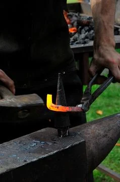 The blacksmith, a person who creates objects of iron or steel  Stock Photos