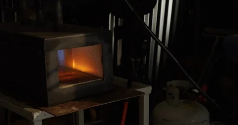 Blacksmith places old horseshoe in forge Stock-Footage 120419408