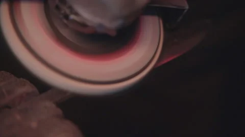 Blacksmith polishing knife blade with grinder. Damascus steel knife. Stock Footage 194485459
