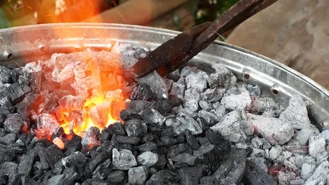 A blacksmith pounding a hammer on red-hot horseshoe on the anvil. Stock Footage 94267672
