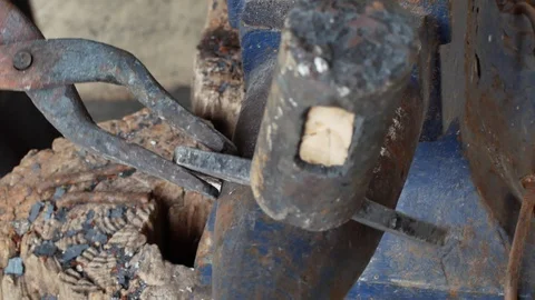 A blacksmith pounding a hammer on red-hot horseshoe on the anvil. Stock Footage 94268118
