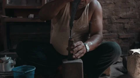 Blacksmith presses knife into knife handle, smoke flying Stock Footage 165275819