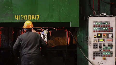 Blacksmith processes the red hot iron under a huge press. Stock Footage 224307732