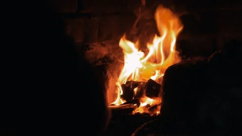 The blacksmith pulls out a red-hot workpiece from the hot oven Stock Footage 133077982