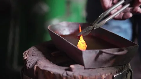 Blacksmith quenching arrowhead Stock Footage 245263151