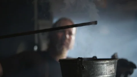 Blacksmith quenching iron Video stock 92058623