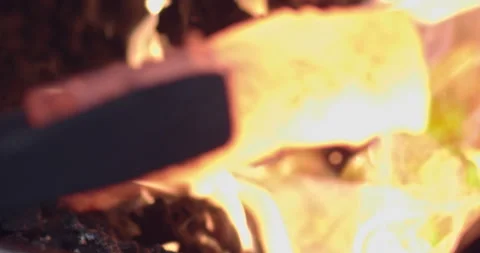 Blacksmith removes metal from Forge and begins to form Axe 스톡 동영상 152253978