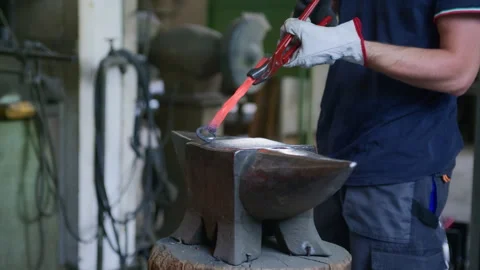 Blacksmith Rotating Hot Metal on Anvil – Side Angle Close-Up of Forging Process Stock Footage 313850853
