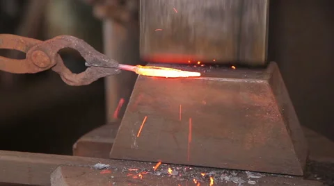Blacksmith shaping a hot steal Stock Footage 59898804
