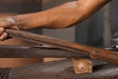 Blacksmith sharpening a blade 스톡 사진