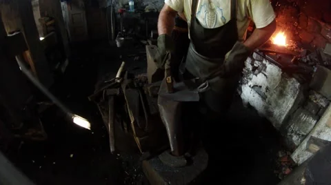 Blacksmith shoeing a shovel on the anvil Stock Footage 46446517