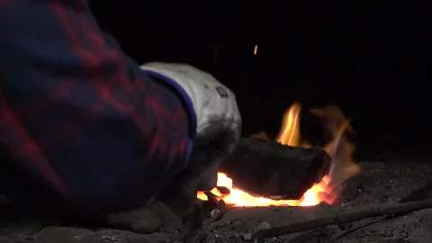 The blacksmith takes hot metal out of the hot stoves Stock Footage 155679154