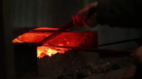 Blacksmith takes iron Stock Footage 72219765